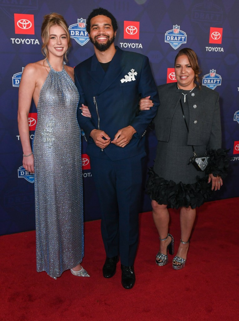 Caleb Williams attends the 2024 NFL Draft with his girlfriend (left) on April 25, 2024.