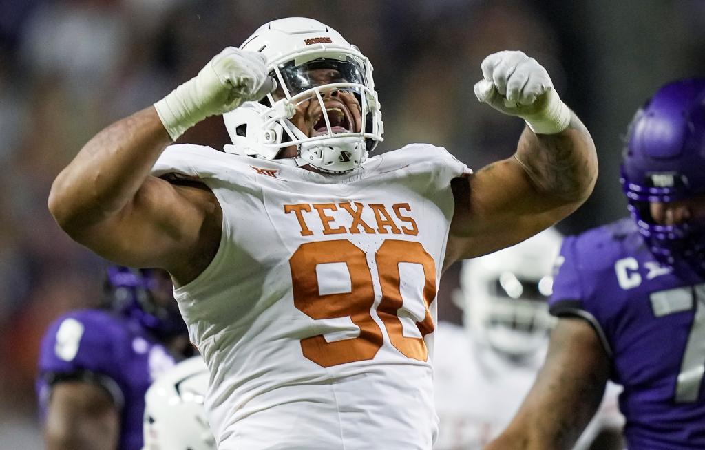 Texas defensive lineman Byron Murphy II (90) celebrates after a sack