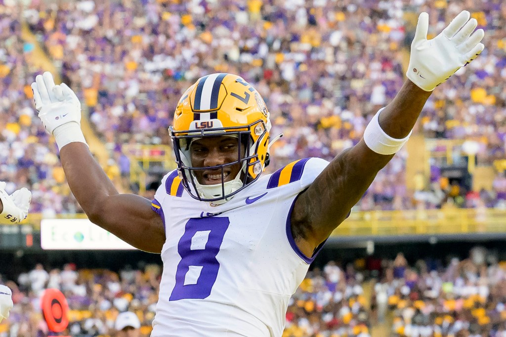 LSU wide receiver Malik Nabers celebrating after a touchdown during a college football game, selected as No. 6 pick in the 2024 NFL Draft by the Giants