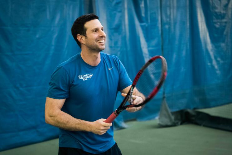 Chris DeStefano, a tennis instructor at Stadium Tennis Center in Bronx NY, holding a tennis racket, photo by Stefano Giovannini