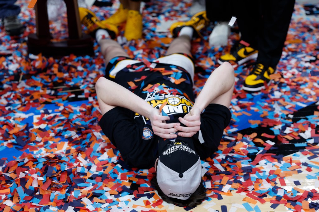 Caitlin Clark celebrates after Iowa defeated LSU to advance to the Final Four.