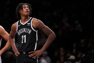 Noah Clowney #21 of the Brooklyn Nets looks on against the Miami Heat at Barclays Center on November 25, 2023 in the Brooklyn borough of New York City. The Nets defeated the Heat 112-97.