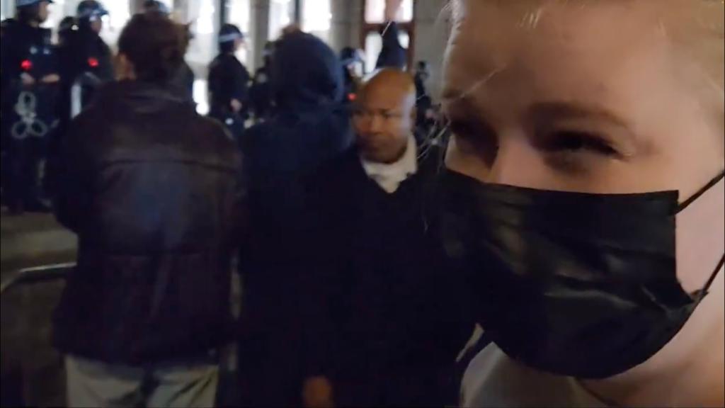 At one point, she turned to her friend (pictured above) to ask if she knew why NYU was protesting -- with the friend responding: "About what?"