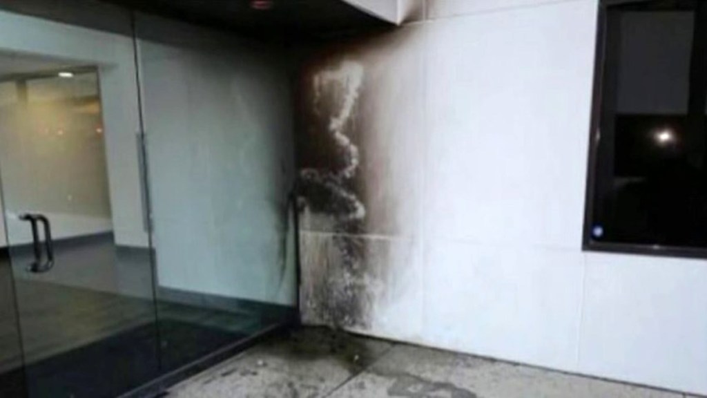 A photo of damage to a Planned Parenthood in Costa Mesa, California, following the attack on March 13, 2022 is shown. 
