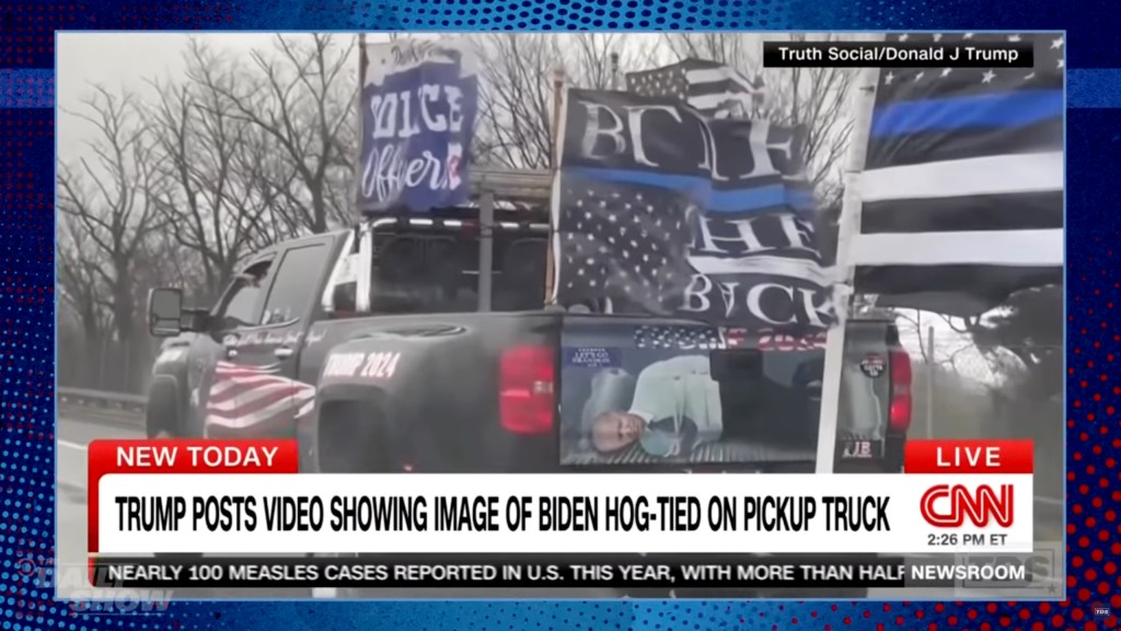 Trump posted a video showing an image of Biden hog-tied on a pick-up truck.