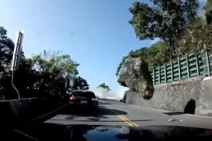 The earthquake in Taiwan triggered a rockslide that sent boulders flying at cars on a mountainous road.