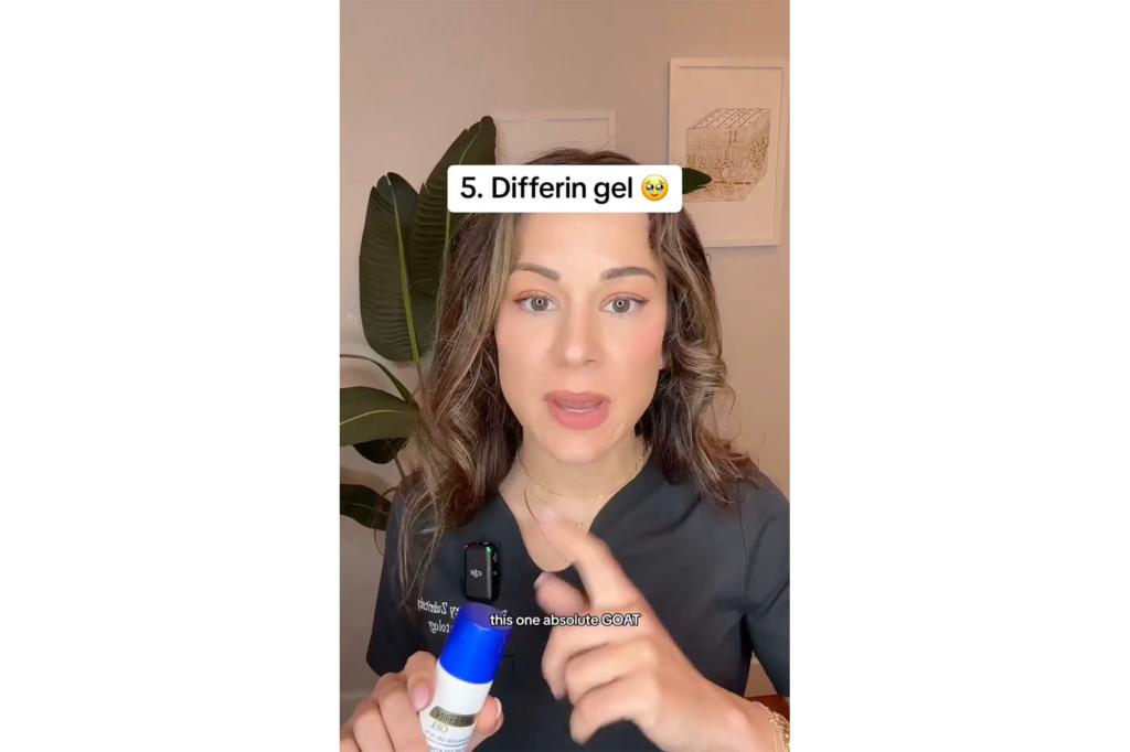 A woman holding a blue and white gel tube