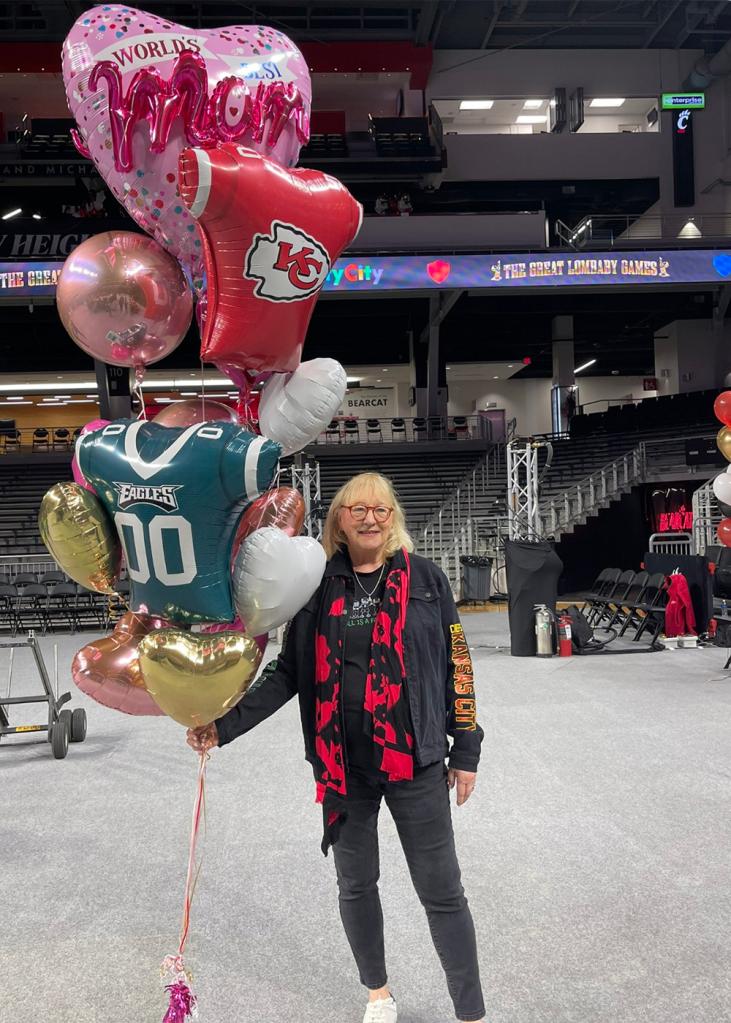 Donna Kelce holds a bunch of Party City balloons while at the "New Heights" live taping at Fifth Third Arena in Cincinatti, Ohio on April 11, 2024. 