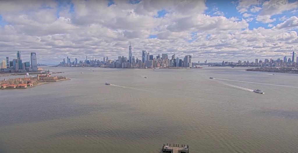 Live footage from EarthCam showing the impact of a 4.8-magnitude earthquake on the New York City skyline with boats in the water