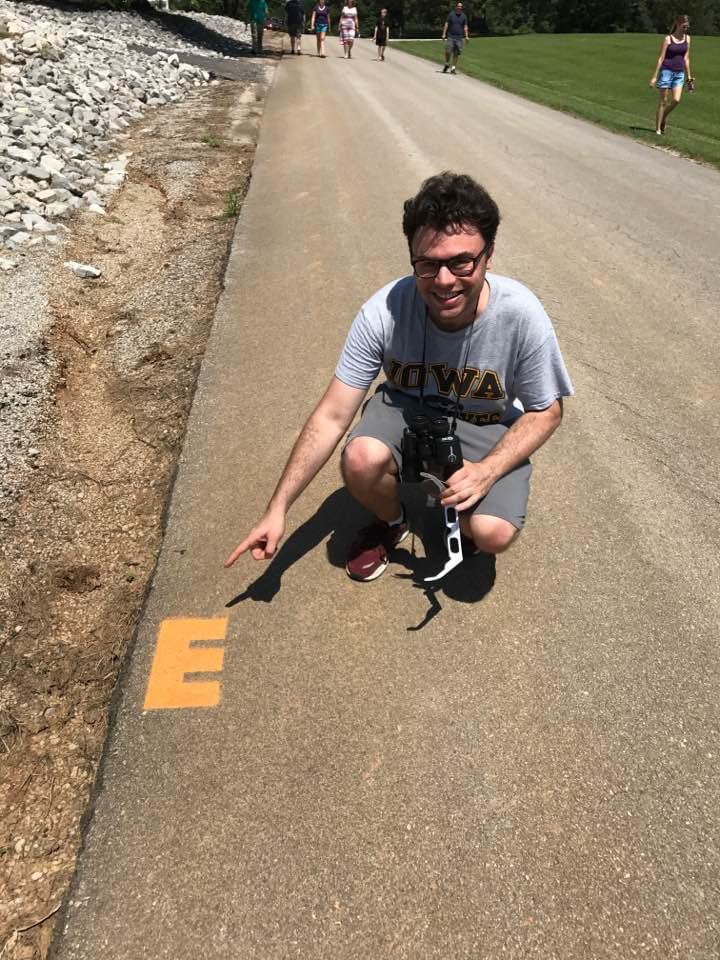 Daniel Mescon gesturing to a marker for the 2017 eclipse