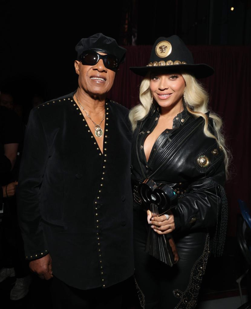 Stevie Wonder and Beyoncé posing backstage at the 2024 iHeartRadio Music Awards after Beyoncé's Innovator Award win
