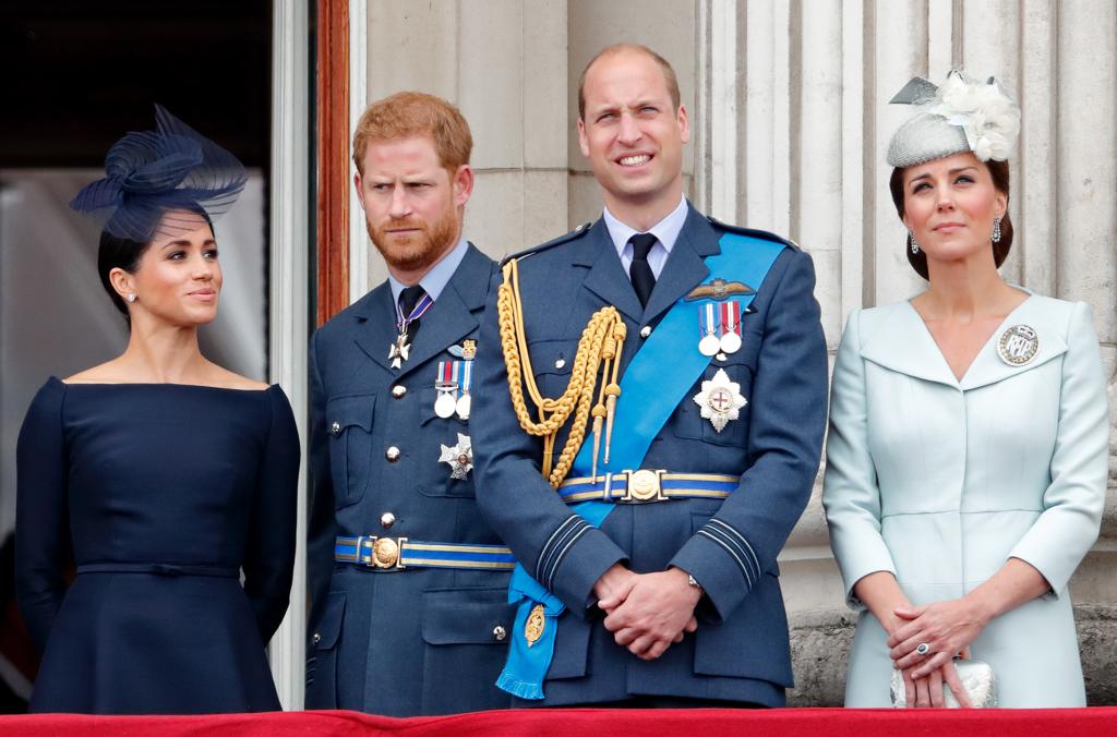 Members of the Royal Family, including Prince William, Prince Harry, and Meghan, Duchess of Sussex, observing a flypast from Buckingham Palace balcony to mark the centenary of the Royal Air Force