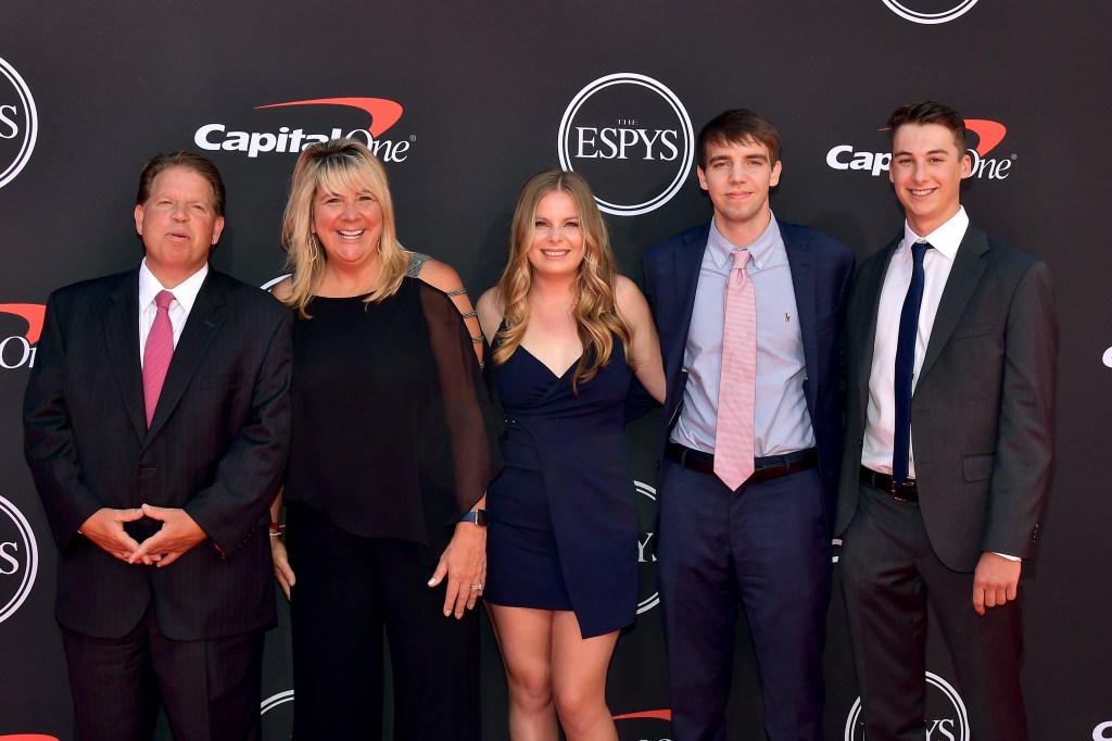 ESPN Executive Vice President Norby Williamson and guests posing for a photo at the 2019 ESPYs in Microsoft Theater, Los Angeles, California.