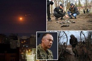 An explosion of a drone is seen in the sky over the city during a Russian missile strike.