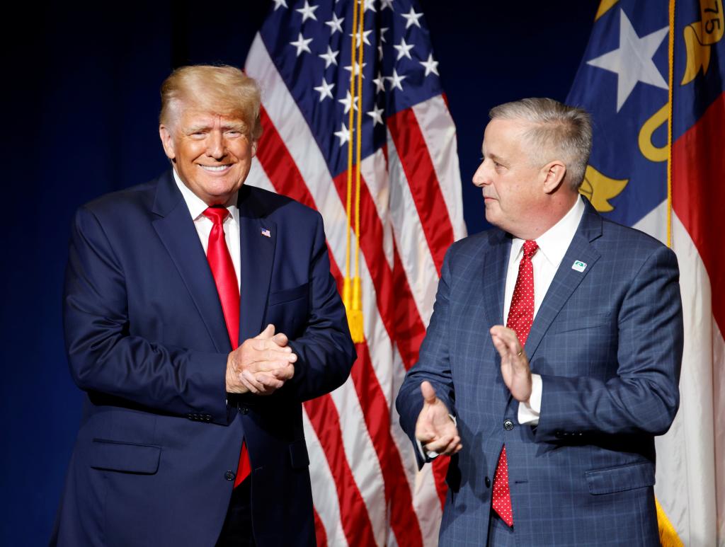 Donald Trump is introduced by North Carolina Republican Party chairman Michael Whatley before speaking at the North Carolina GOP convention dinner in Greenville, North Carolina, U.S. June 5, 2021.  