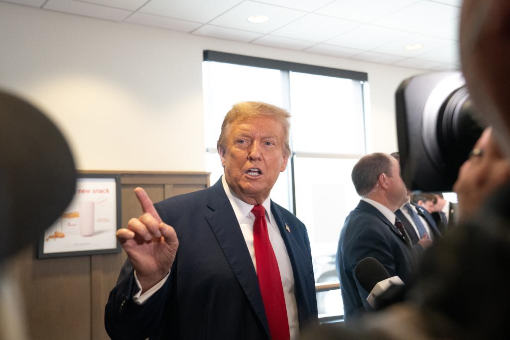 Former U.S. President Donald Trump speaks to the media during a visit to a Chick-fil-A restaurant on April 10, 2024 in Atlanta, Georgia. 