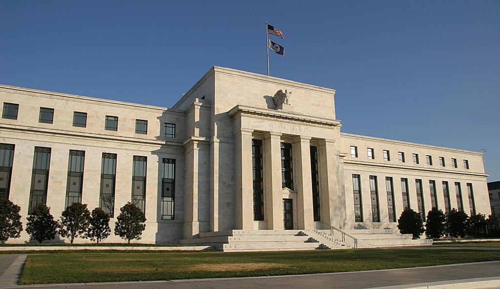 Front view of the US Federal Reserve building in Washington, DC with flag on top