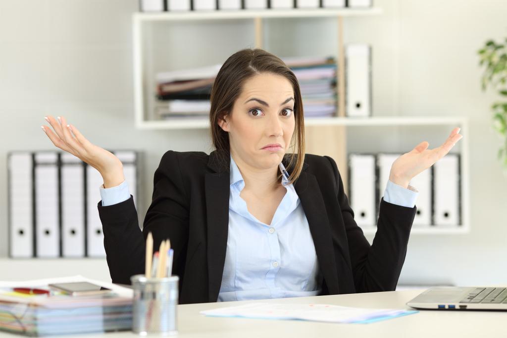 Front view portrait of a confused businesswoman 