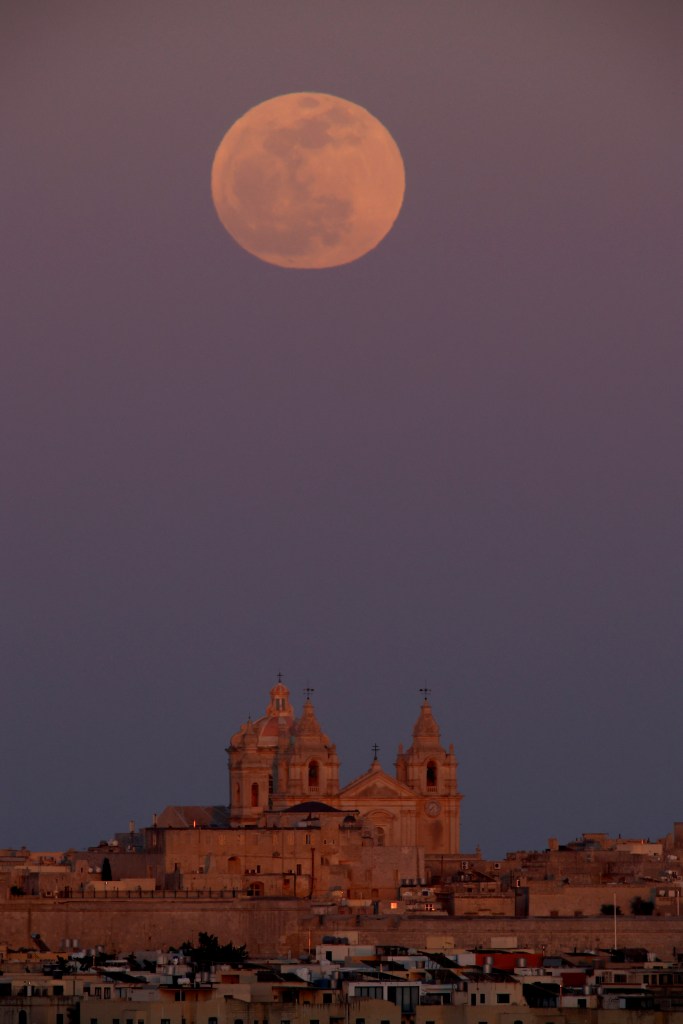 The full moon over St. Paul's Metropolitan Cathedral in Mdina, Malta.