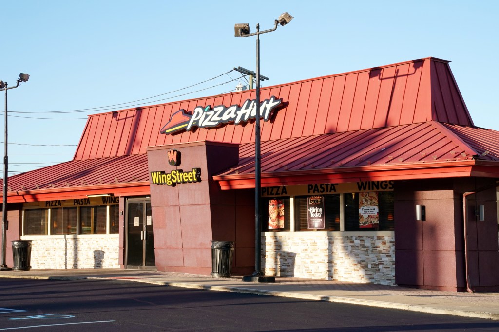 A Pizza Hut sign prominently displayed outside the restaurant in Woodland Park, NJ on October 23, 2023