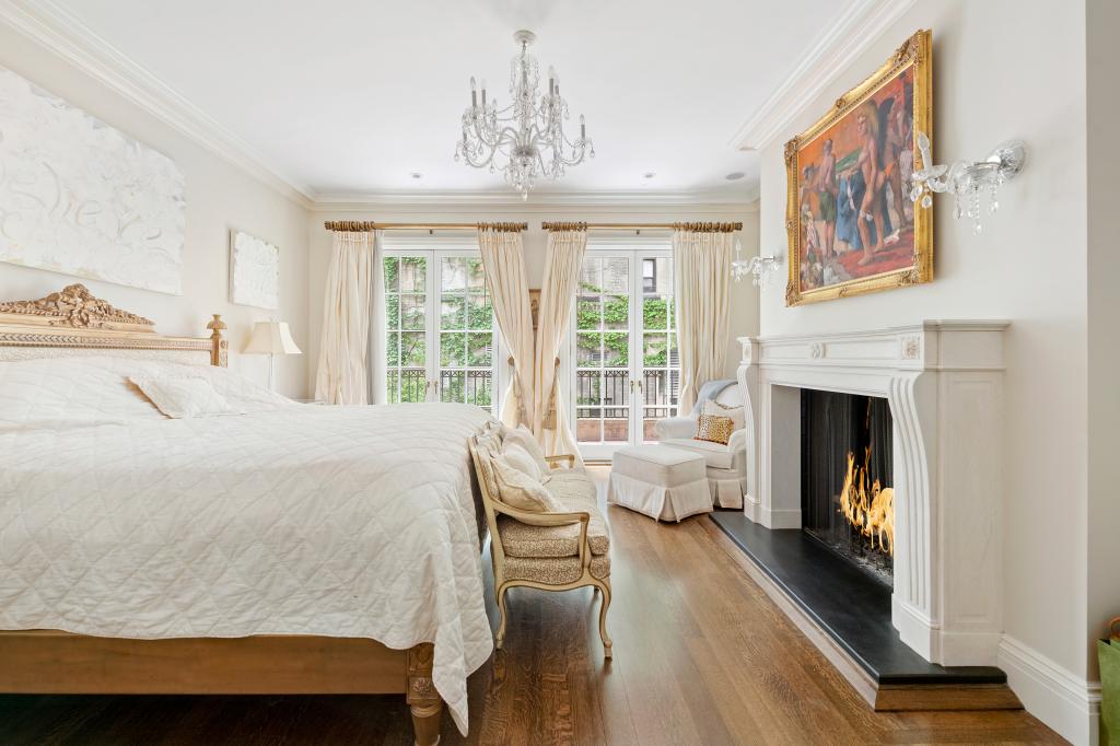 A fireplace keeps the bedroom warm and toasty on E. 68th St. 