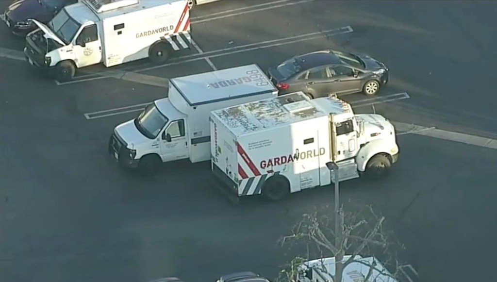 Police trucks near the scene of the robbery.