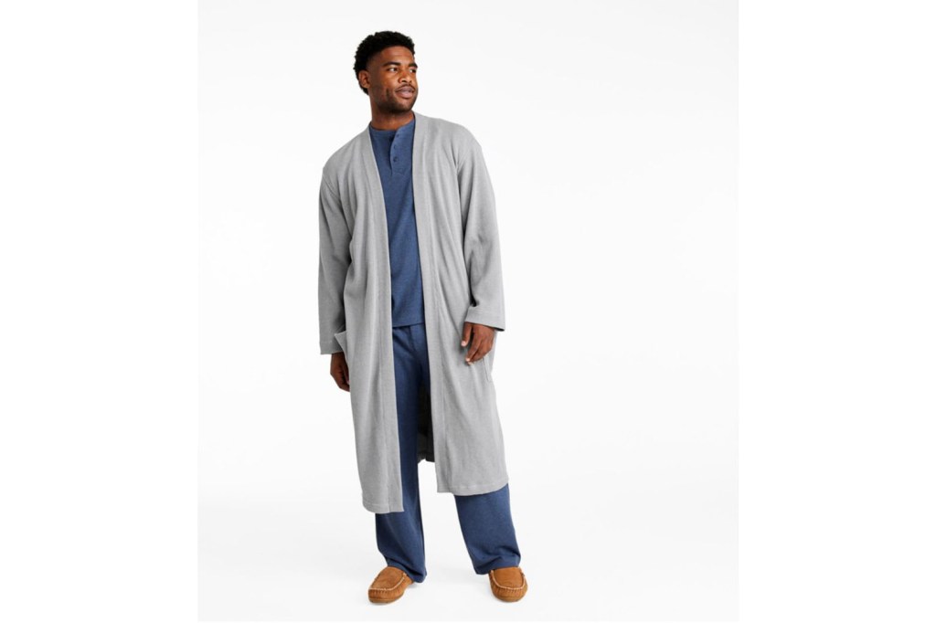 A man wearing a grey robe and pants