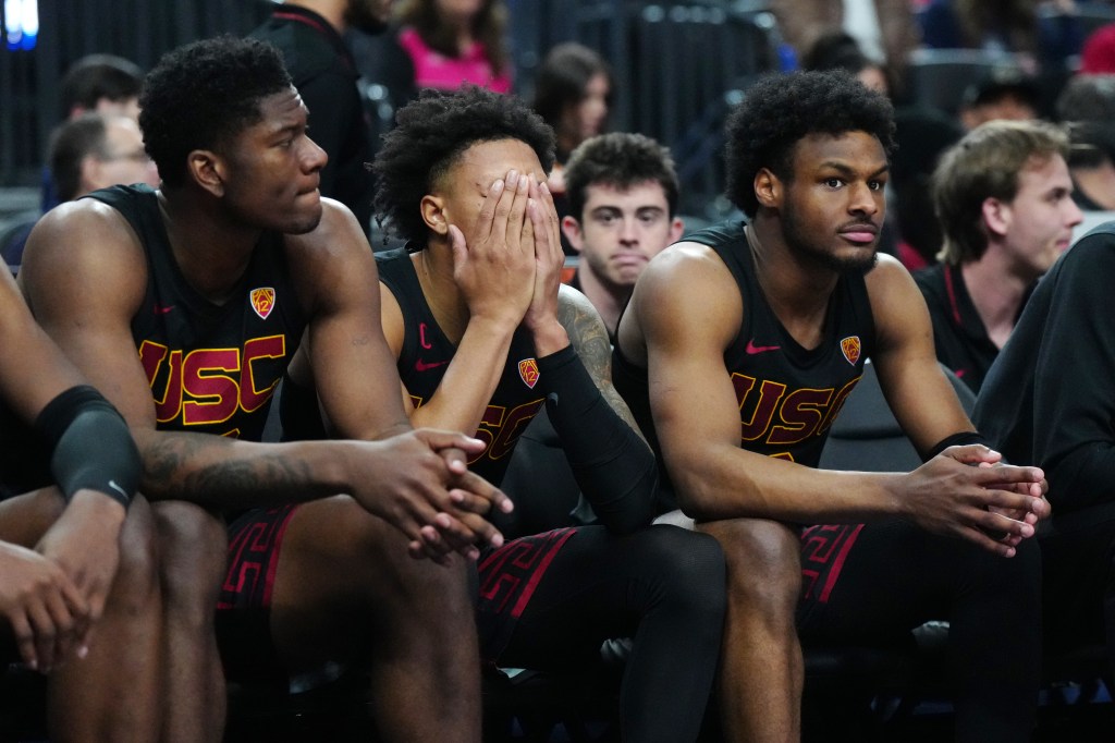 Southern California Trojans players Kijani Wright, Boogie Ellis, and Bronny James reacting during a basketball game against Arizona Wildcats