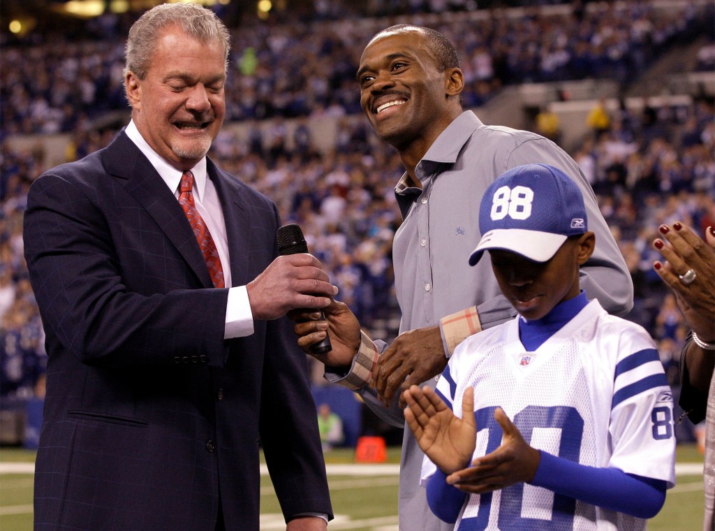 Colts owner Jim Irsay with Marvin Harrison Sr. and his son in 2011.
