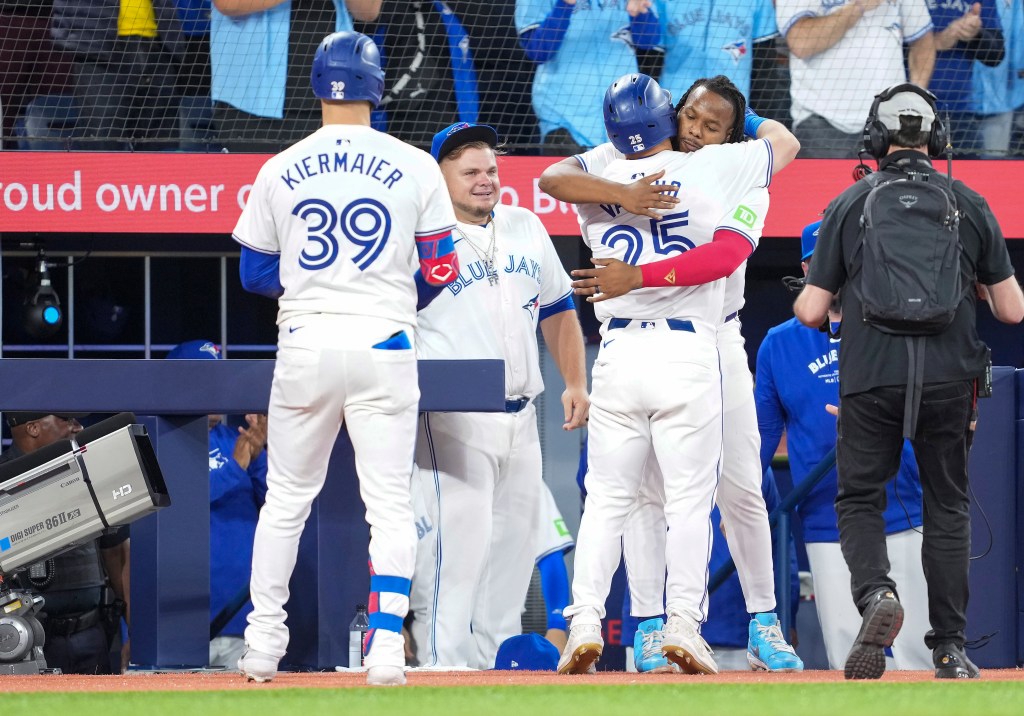 Blue Jays left fielder Daulton Varsho (25) hits a home run and celebrates with first base Vladimir Guerrero Jr. (27) against the New York Yankees