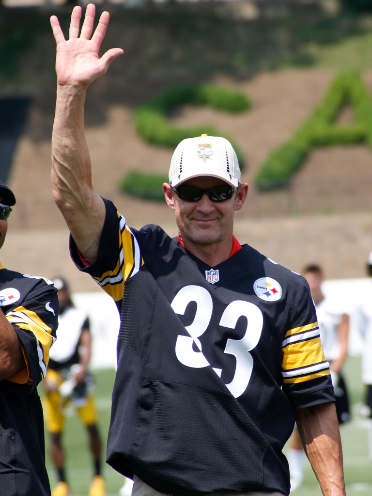 Former Pittsburgh Steelers running back Merril Hoge waving to fans at Saint Vincent College during NFL training camp, 2015