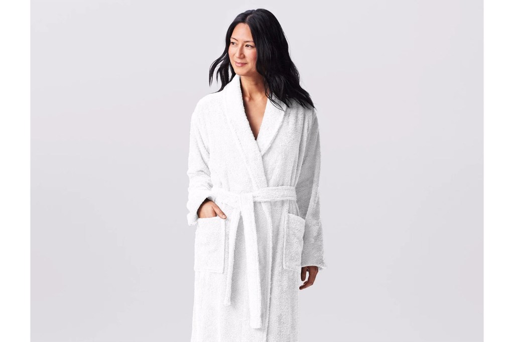 A woman in a white hotel robe