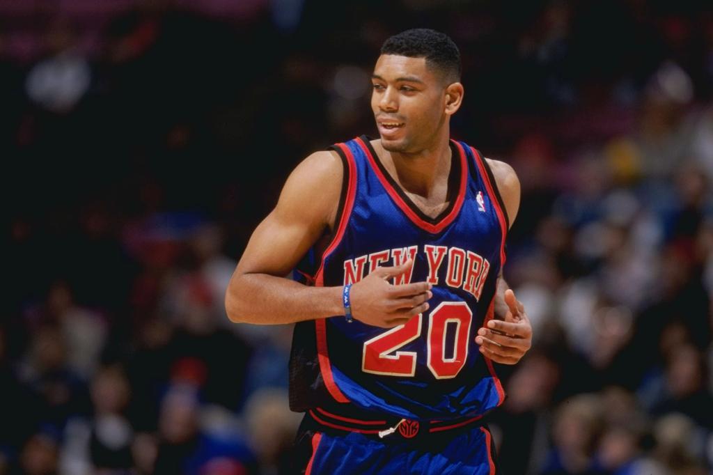 Allan Houston #20 of the New York Knicks runs down the court during a game against the New Jersey Nets at the Continental Airlines Arena in East Rutherford, New Jersey. 
