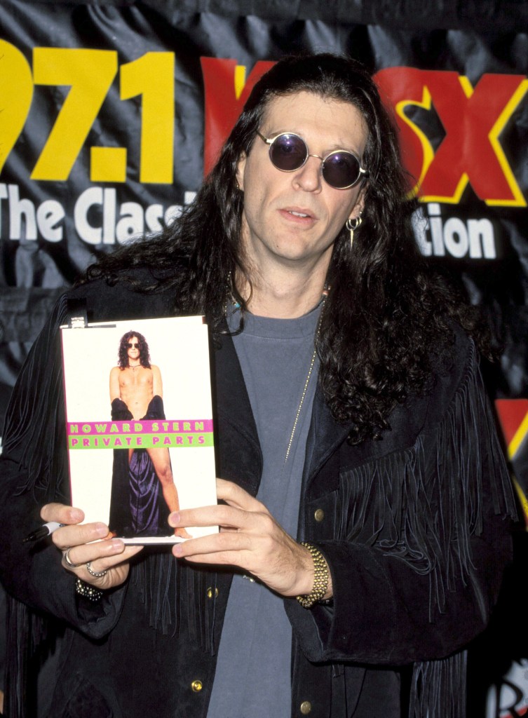 Howard Stern holds his 1993 memoir, "Private Parts" at a book signing.