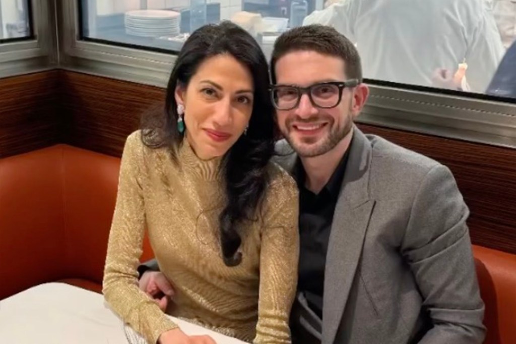 Huma Abedin and Alexander Soros in a restaurant.