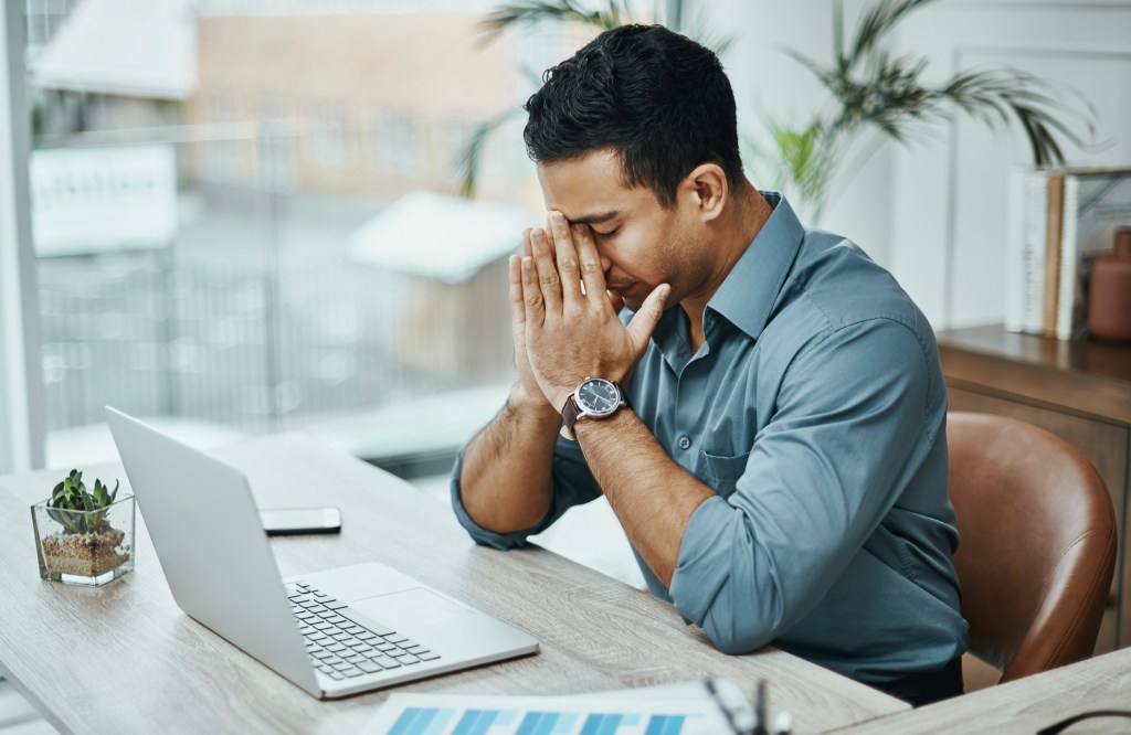 A man stressed at work.