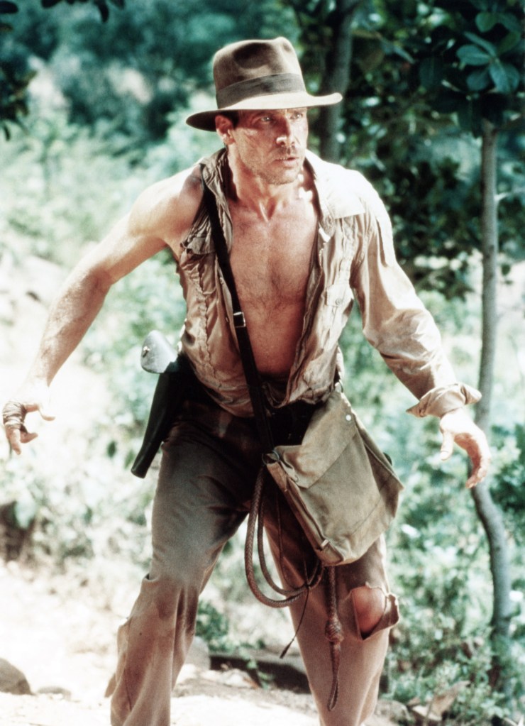 Harrison Ford playing the character Indiana Jones and wearing a fabric satchel in the 1984 movie, Indiana Jones and the Temple of Doom