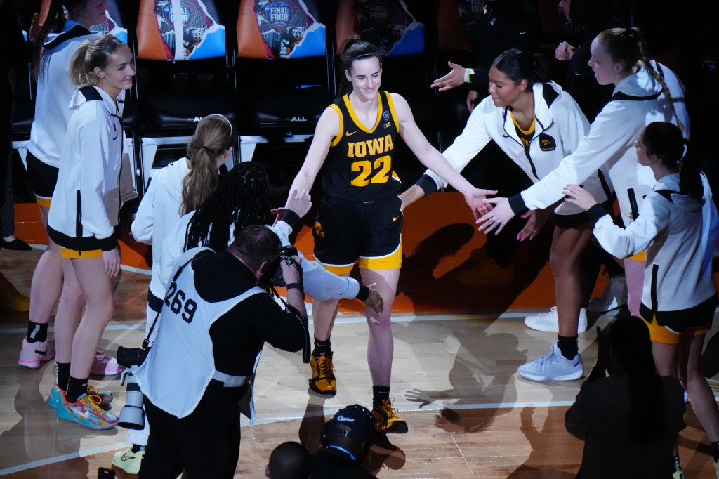 Iowa Hawkeyes guard Caitlin Clark (22) is introduced during the 2024 NCAA Tournament Women's Final Four championship game against the South Carolina Gamecocks at Rocket Mortgage FieldHouse on April 7, 2024. 