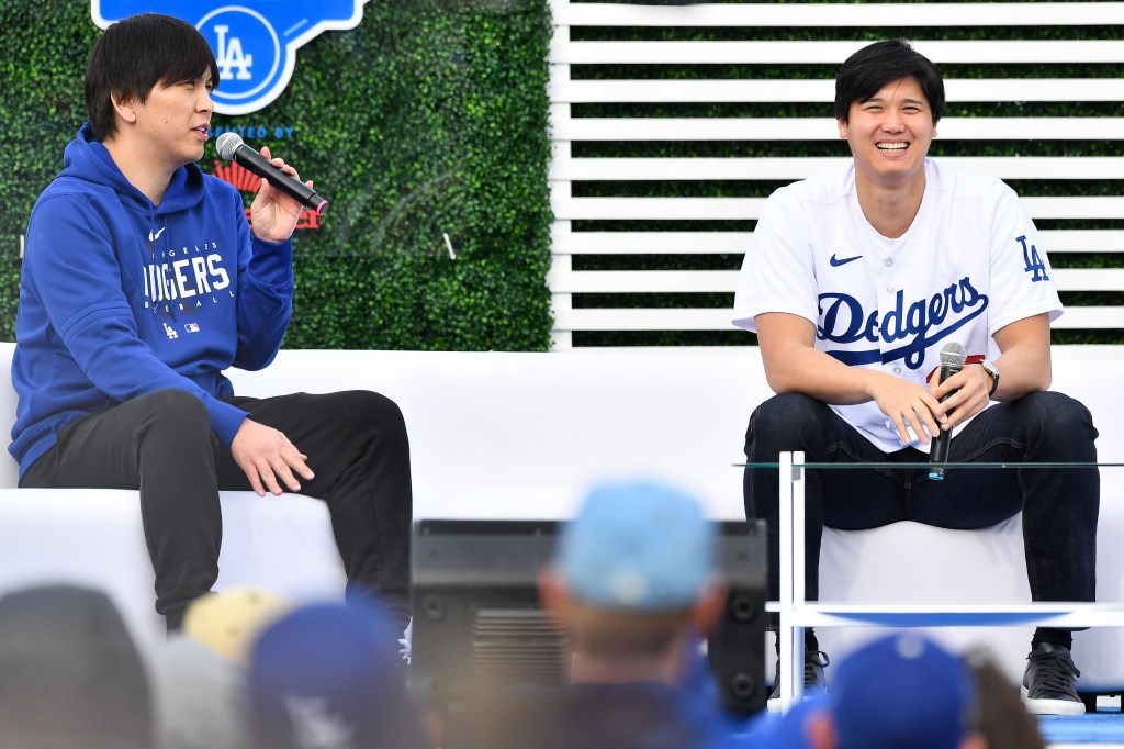 Los Angeles Dodgers designated hitter Shohei Ohtani (17) and his interpreter Ippei Mizuhara looks on during DodgerFest at Dodger Stadium on February 03.