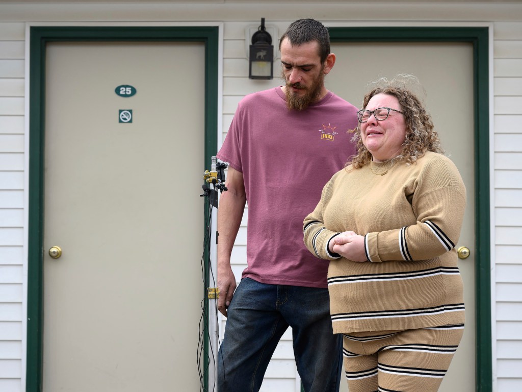 Jake Rowley consoles Sarah Schultz, the widow of David Schulz, after she learned his body had been found.