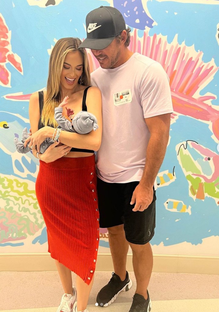 Jena Sims and Brooks Koepka with son Crew in August 2023.