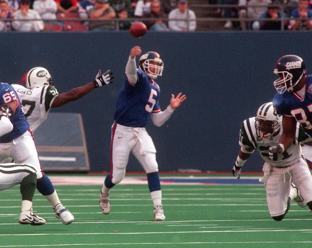 Giant # 5 Kerry Collins in the midst of at pass with good coverage during todays game.