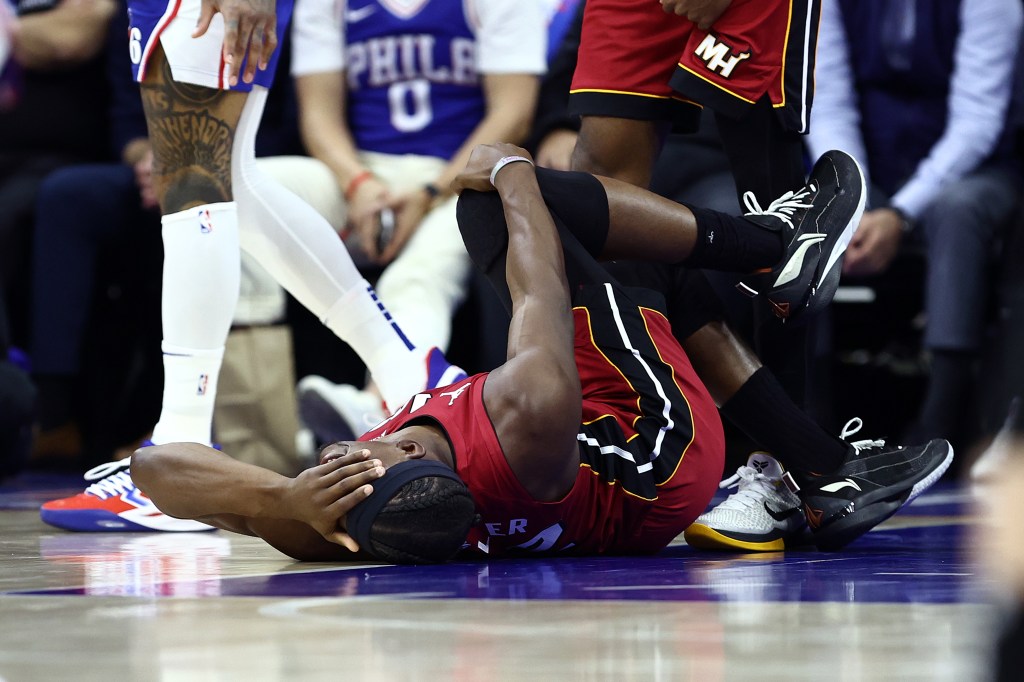 Jimmy Butler #22 of the Miami Heat reacts to an injury during the first quarter against the Philadelphia 76ers during the Eastern Conference Play-In Tournament at the Wells Fargo Center on April 17, 2024 in Philadelphia, Pennsylvania.