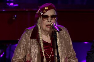 Folk singer Joni Mitchell honored Elton John and Bernie Taupin with a jazzy rendition of their 1983 hit “I’m Still Standing” at the Library of Congress’ Gershwin Prize ceremony on April 8.