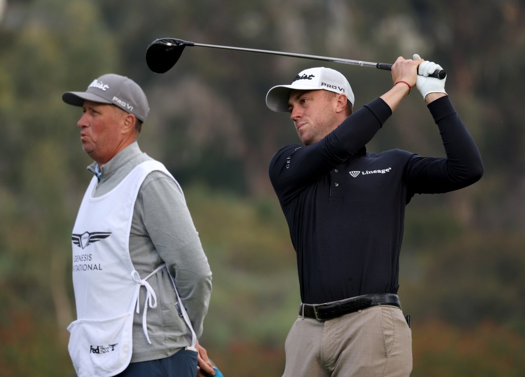 Justin Thomas (r.) and caddie Jim "Bones" Mackay during the Genesis Invitational on Feb. 14, 2024.