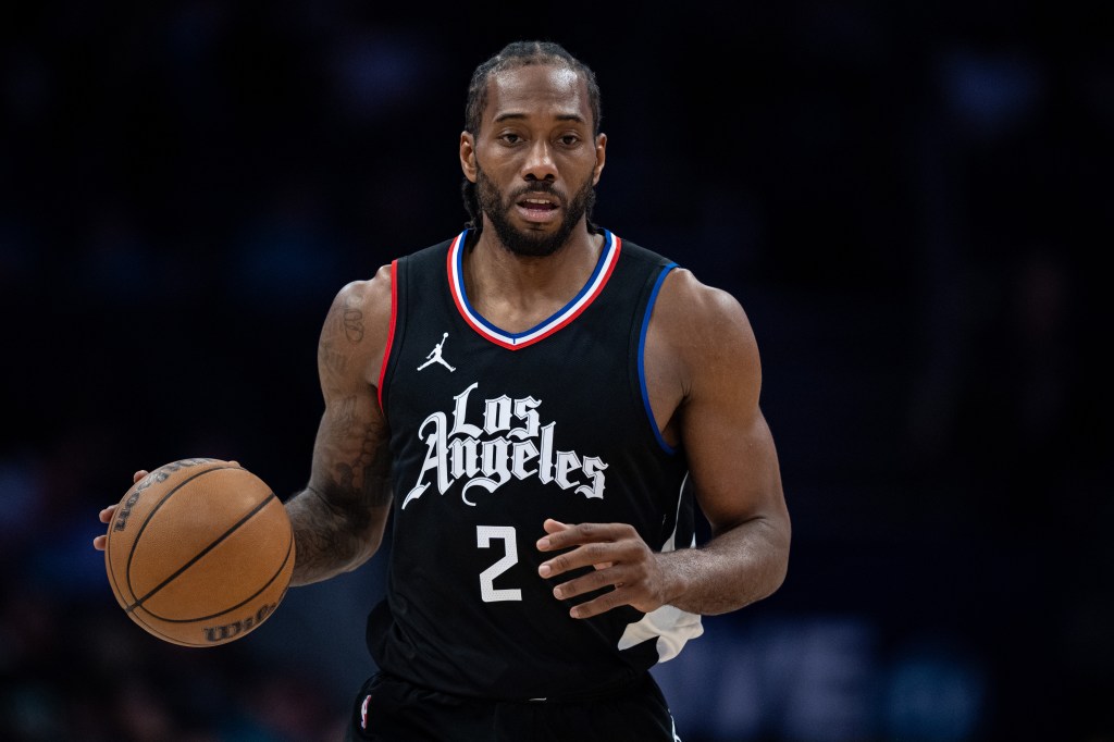 Kawhi Leonard #2 of the LA Clippers brings the ball up court against the Charlotte Hornets during their game at Spectrum Center on March 31, 2024 in Charlotte, North Carolina.