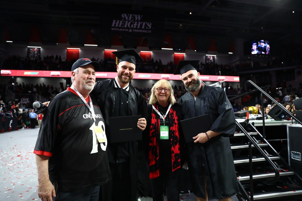 (L-R) Ed Kelce, Travis Kelce, Donna Kelce and Jason Kelce at the live taping of the brothers' “New Heights” podcast at Fifth Third Arena in Cincinnati on April 11, 2024. 
