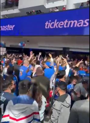 Knicks fans celebrate inside Wells Fargo Center on Sunday.