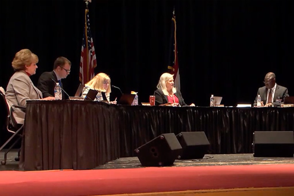 The school board, under the direction of newly sworn-in Interim Superintendent Elizabeth Lolli, unanimously voted to begin Washburn's termination process during a board meeting Tuesday.