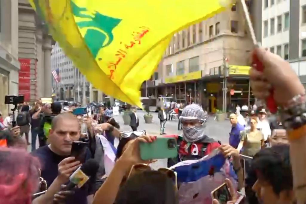 The yellow-and-green flag of the Hezbollah terrorist group waved over Manhattan Monday during an anti-Israel rally